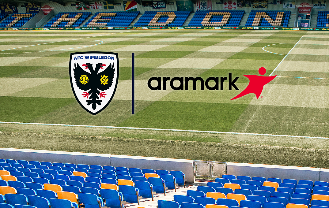 Aramark and AFC Wimbledon logos against a stadium background